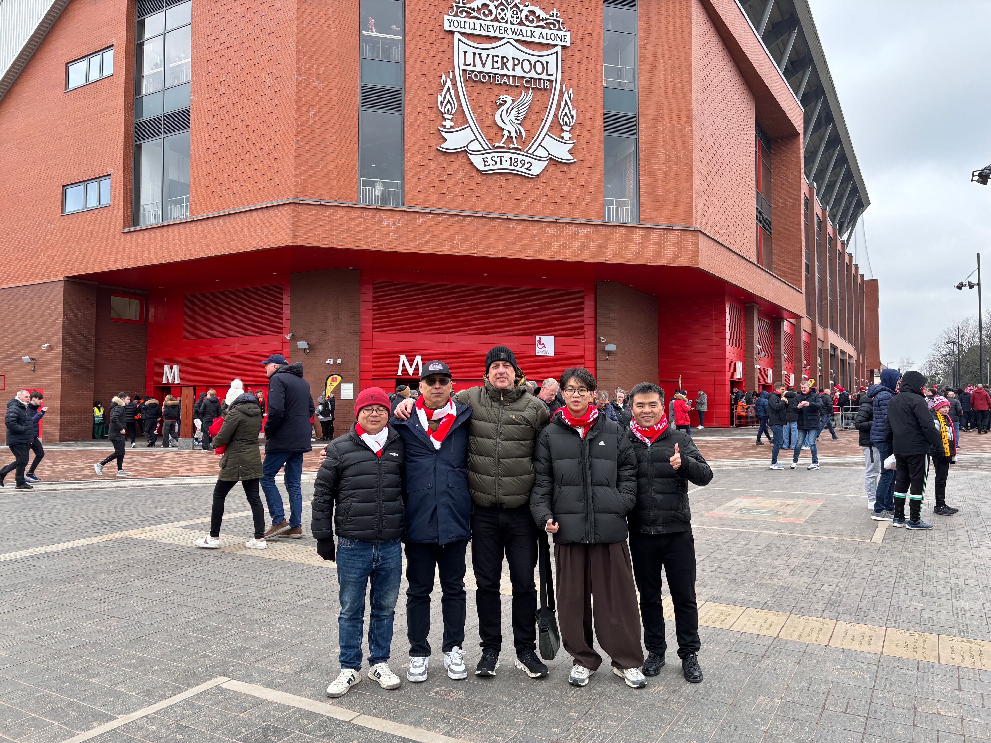 Colin Moore with a long-standing Chinese business partner outside Anfield