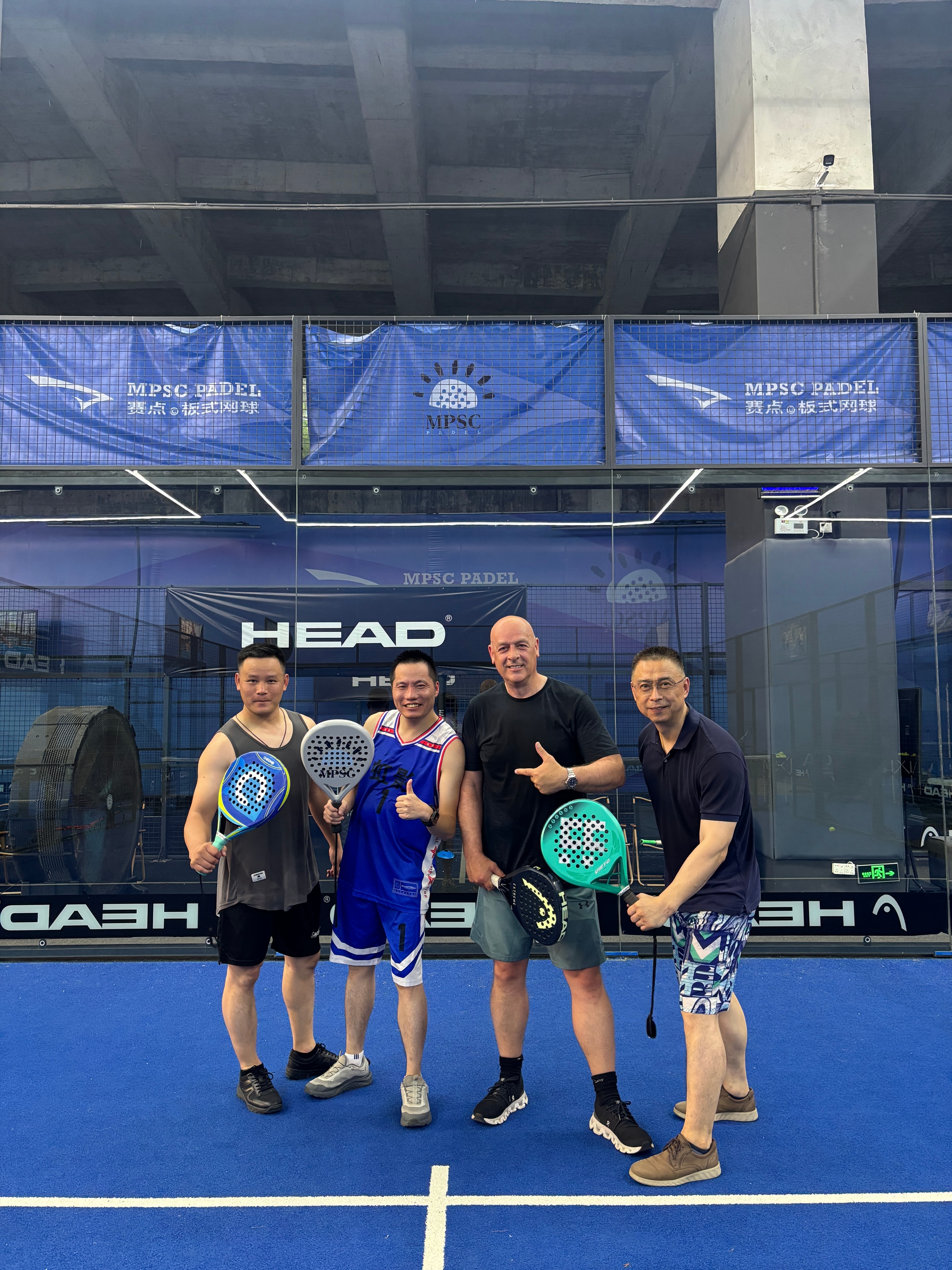 Colin Moore and Mike Yeung playing padel with two Chinese factory owners during a Sauce Asia visit in China.