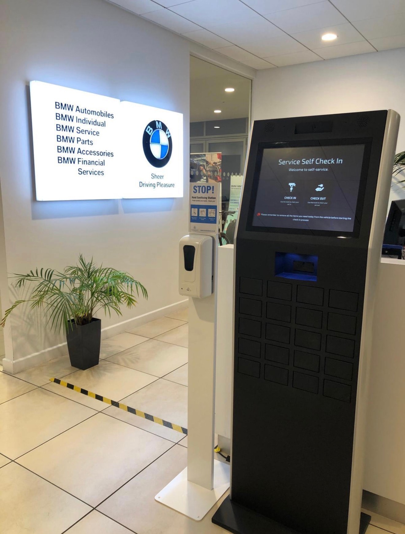 China-manufactured hand-sanitiser station installed at a BMW dealership in the UK