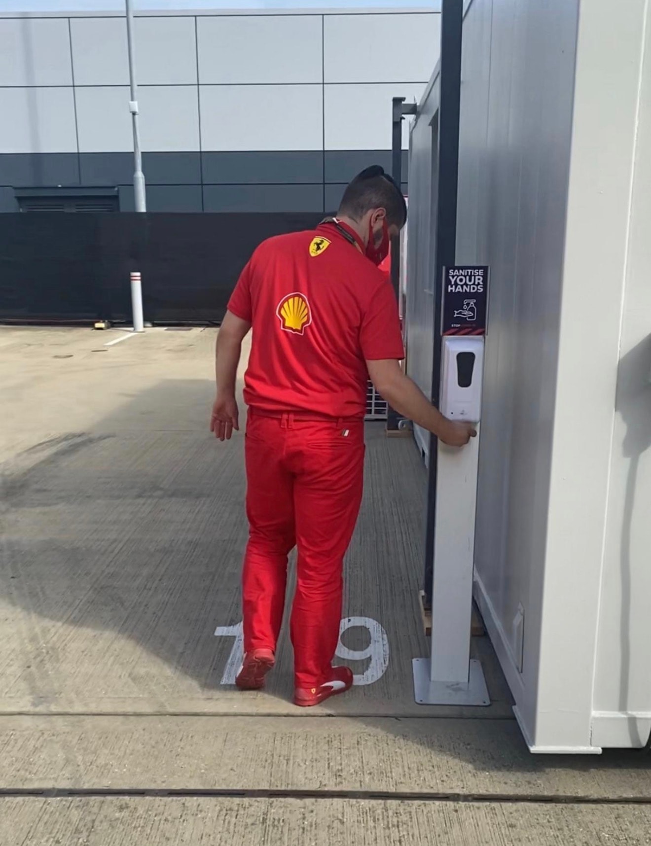 Hand-sanitiser station being used by Ferrari team personnel at Silverstone Circuit