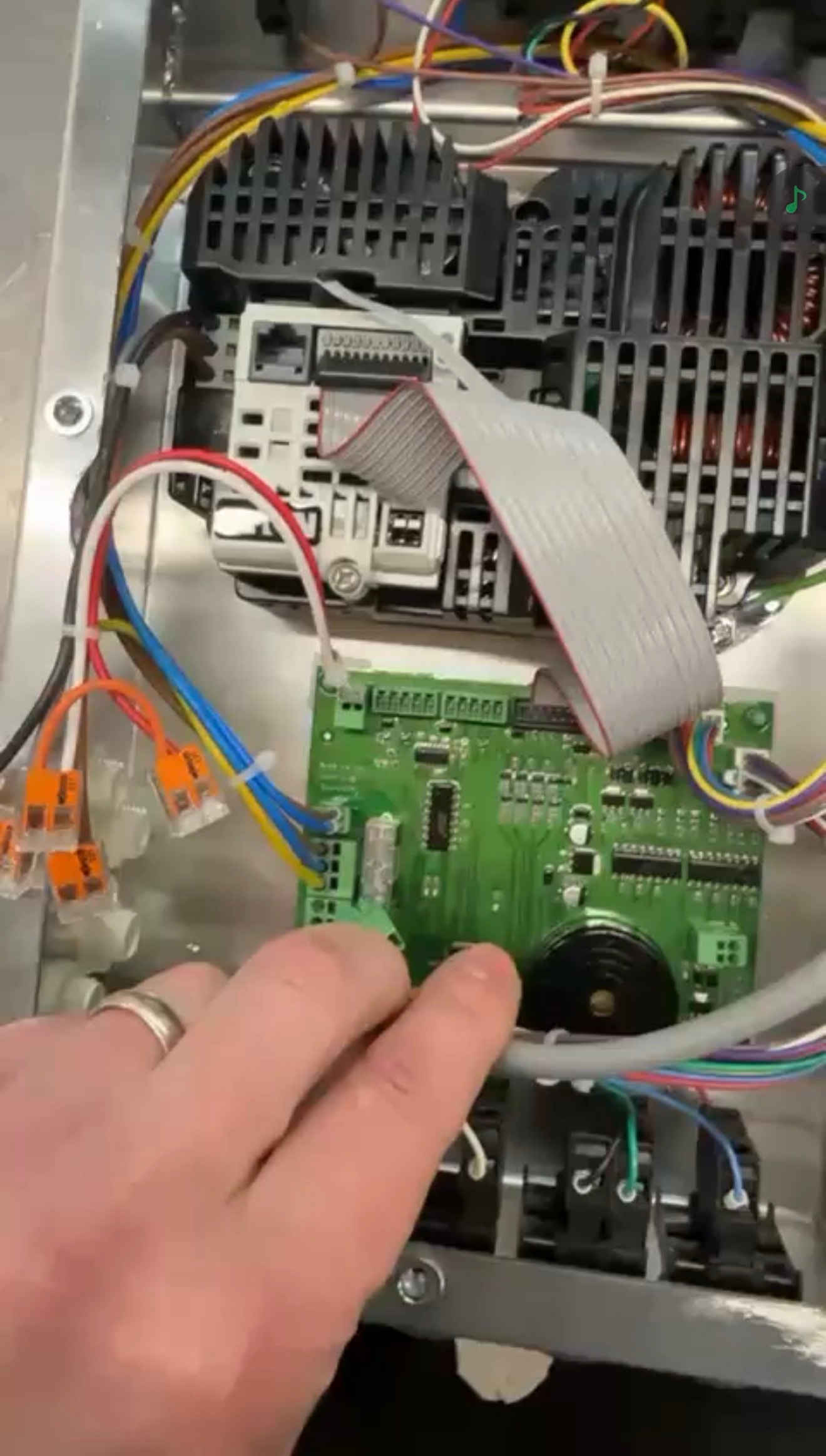 Internal view of the electromechanical assembly showing wiring, connectors and electrical components