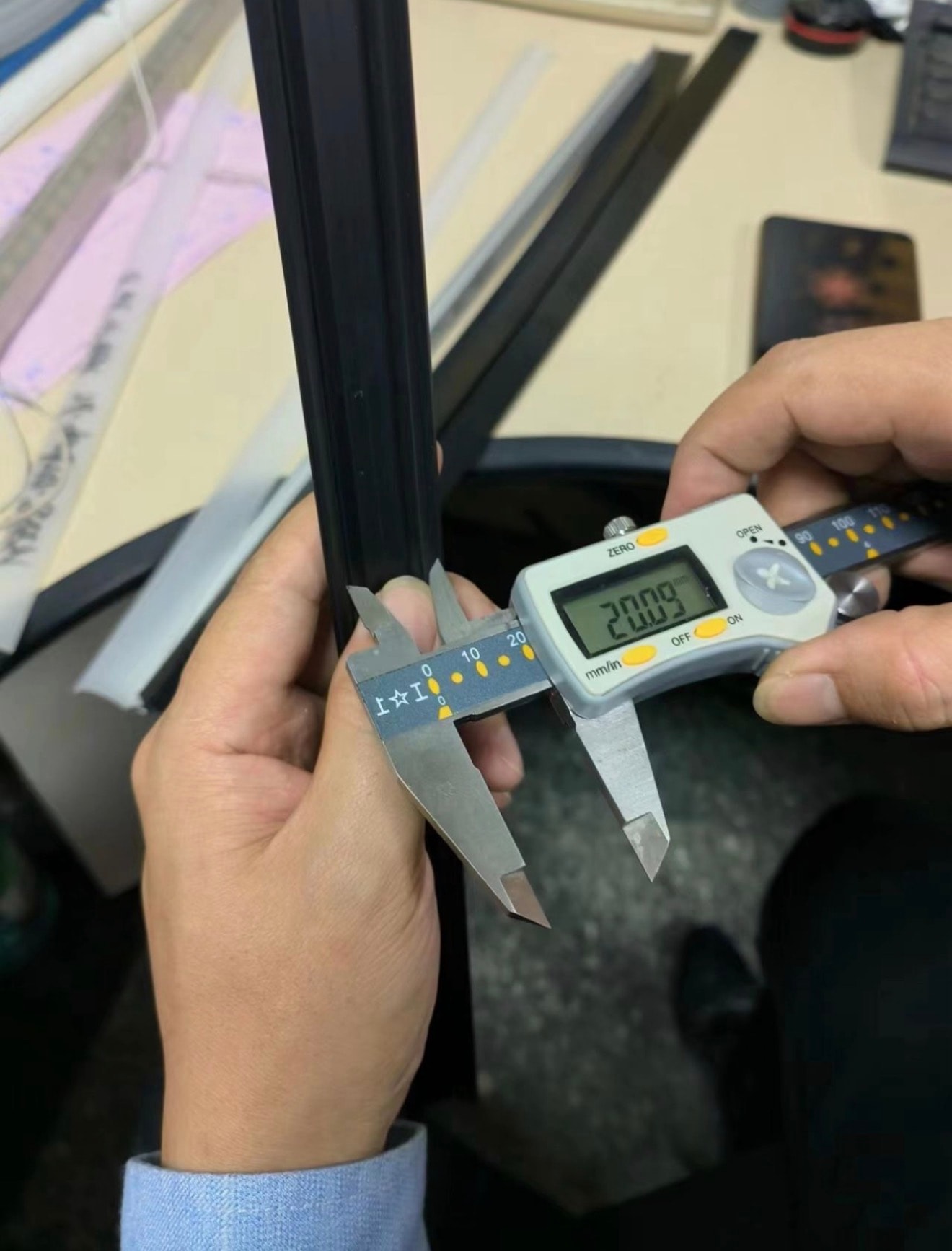 Dimensional check using digital calipers on a metal component